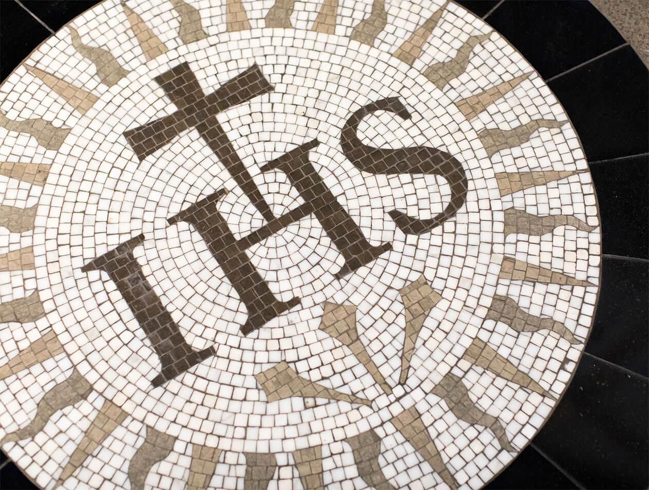 IHS crest in a tile floor