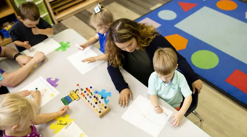 Child development teacher and students
