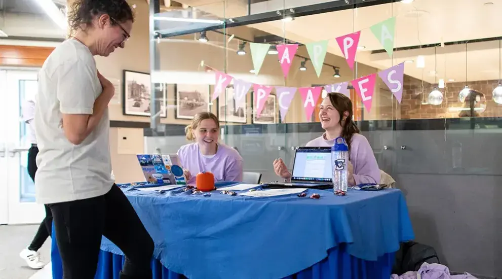 Sorority recruitment table with students.
