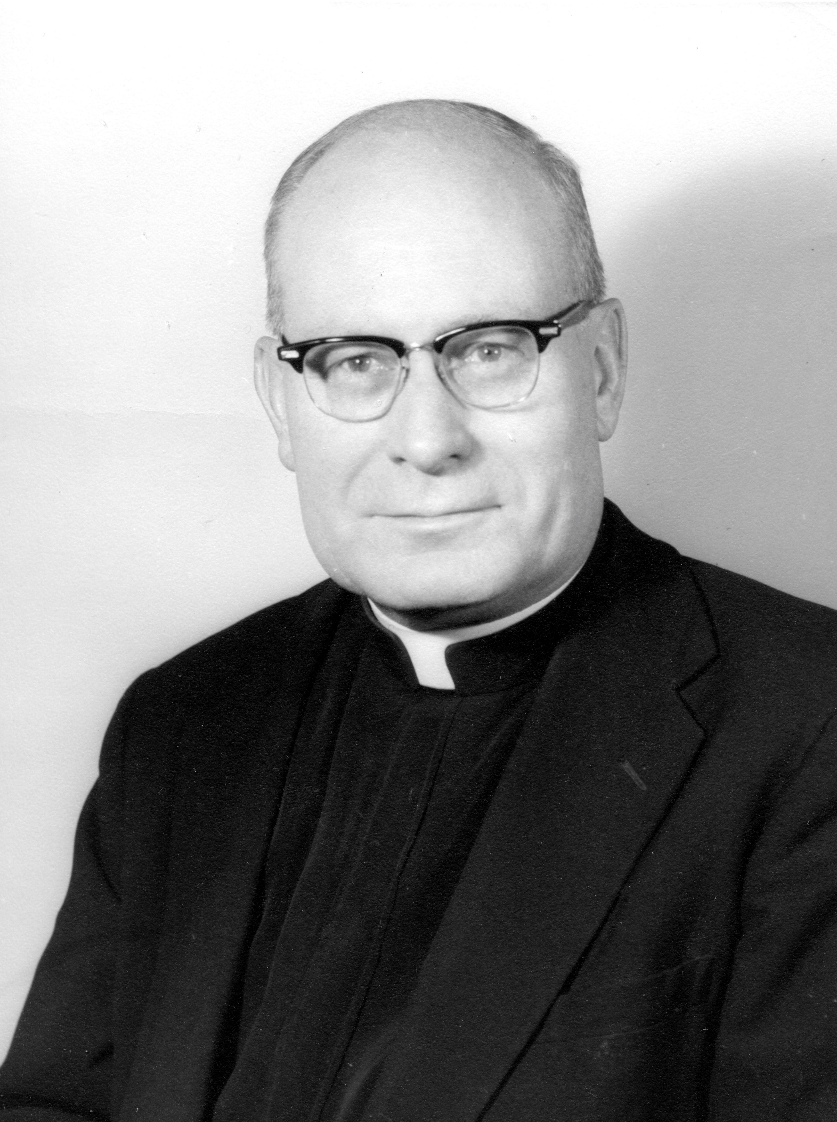 Photograph of Father Raymond J. Bishop from the chest up.