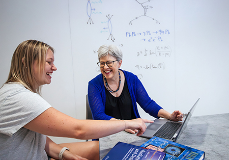 Dr. Seger with student.