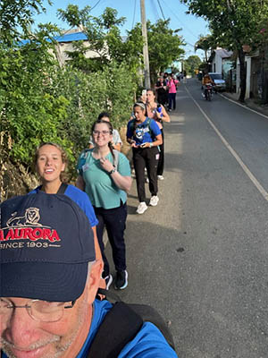 TJ on morning walk with team to the clinic.