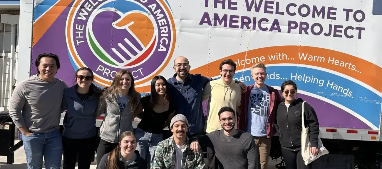 Service participants gathered around America Project truck.