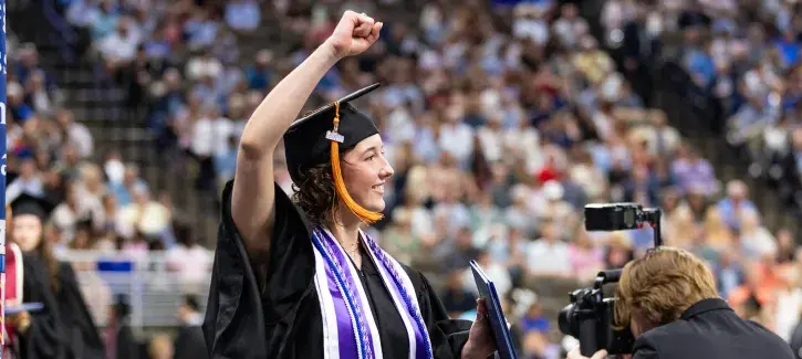 Student graduating at Creighton commencement.
