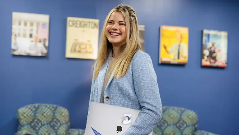 Alum smiling in the office.