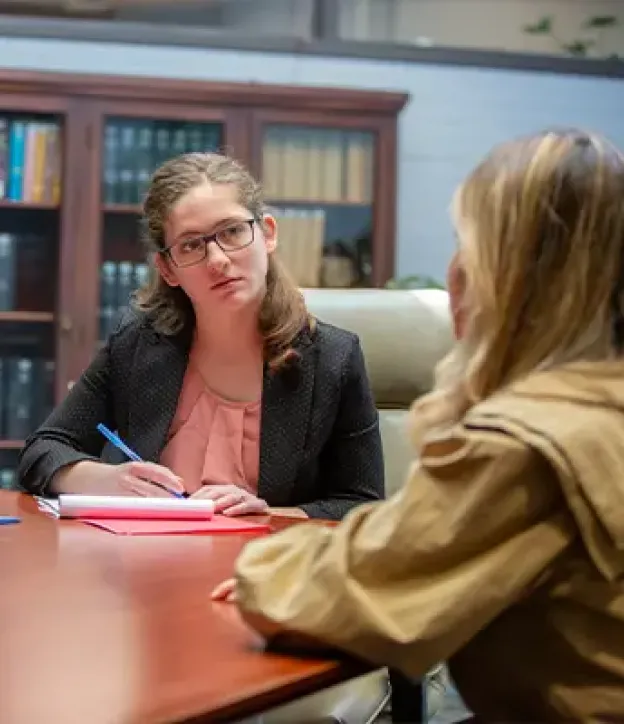 Two students collaborating at table