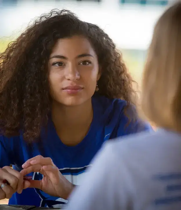 A thoughtful conversation between two students.