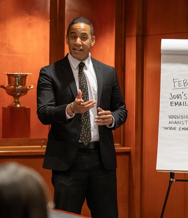 Student making presentation in business suit