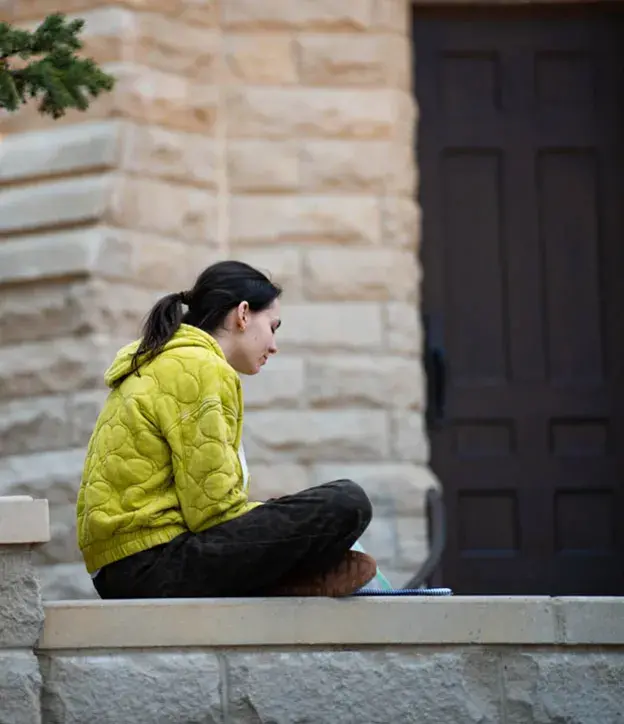 Solitary senior reflecting outside.