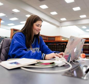 Law student studying with laptop