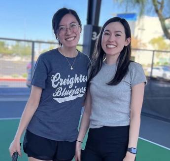 Two residents on court outside