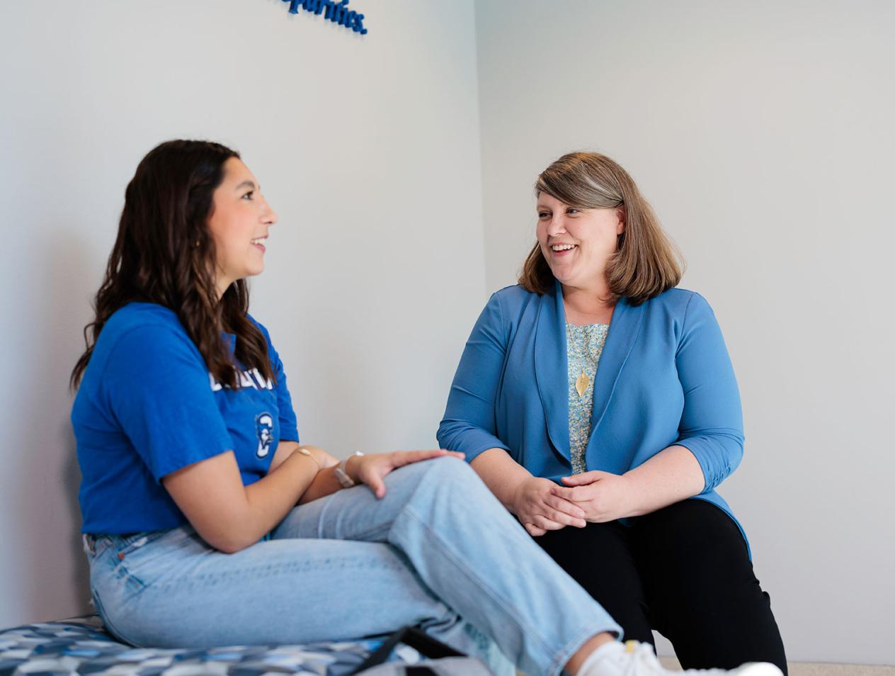 Advising staff member meeting with student