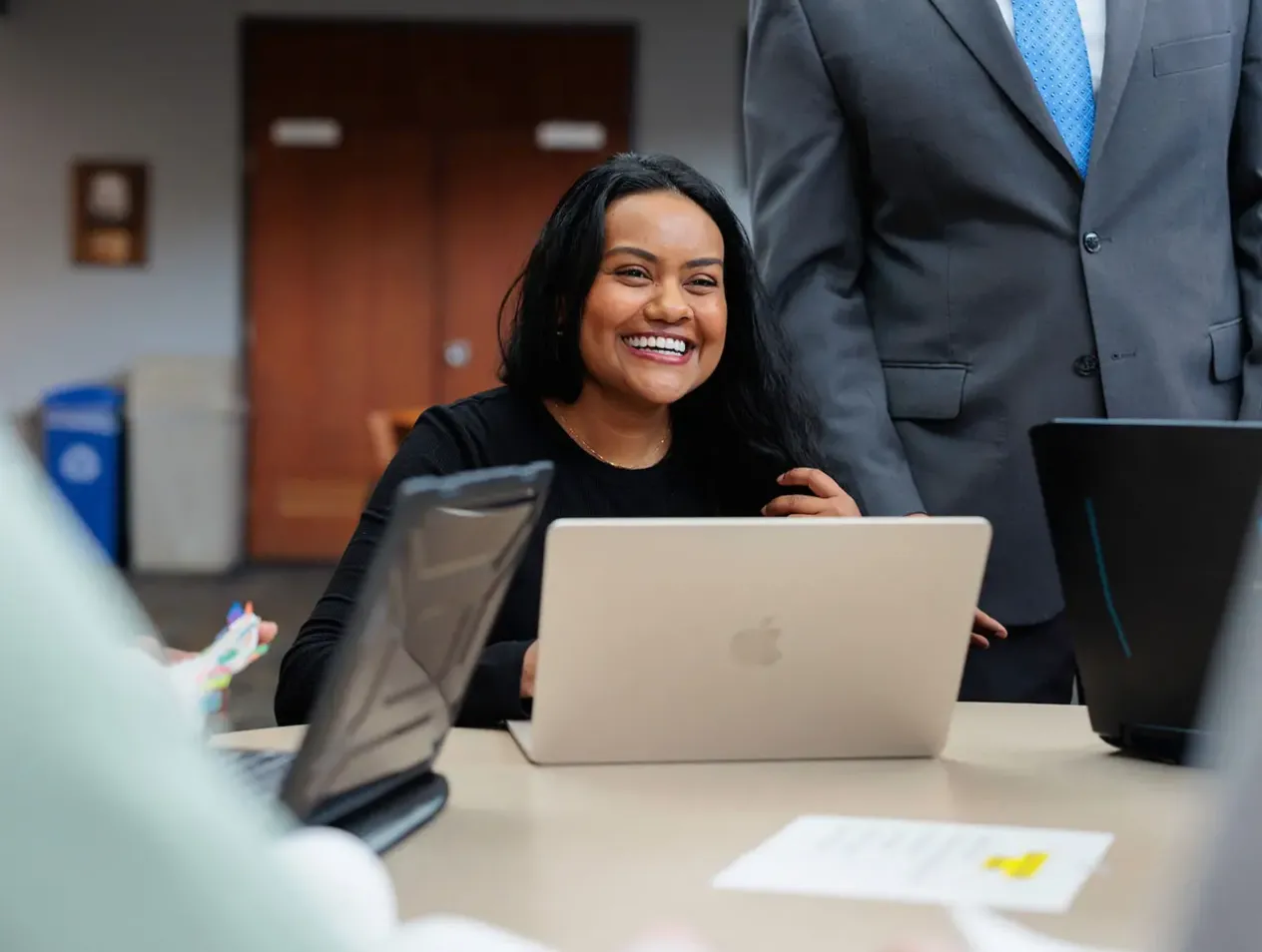 Happy woman on laptop.