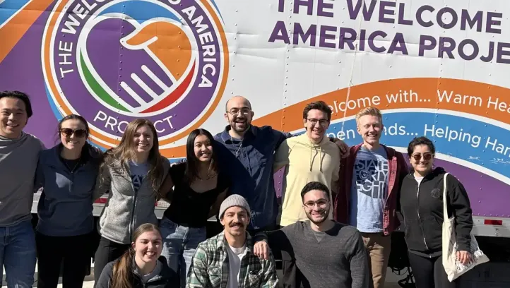 Service participants gathered around America Project truck.