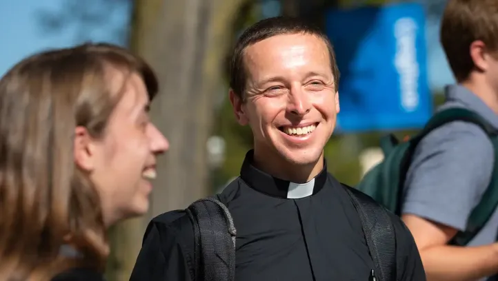 Rev. Christopher Krall attending outside event at Creighton.