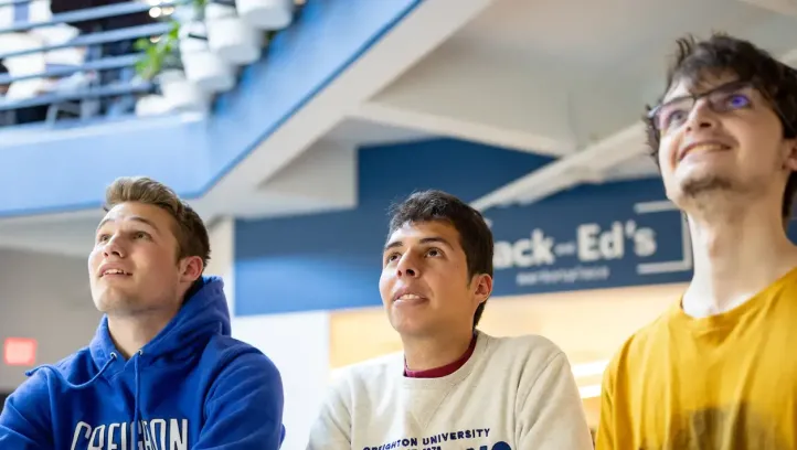 Students watching game on campus.