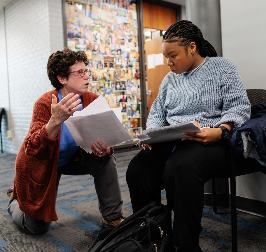 Law faculty and student working together