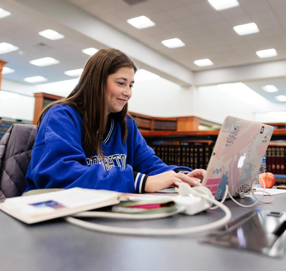 Law student studying with laptop