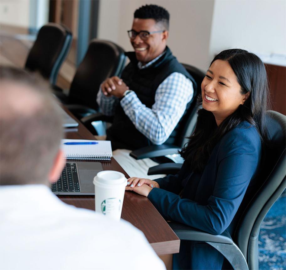 Professionals at table in meeting room