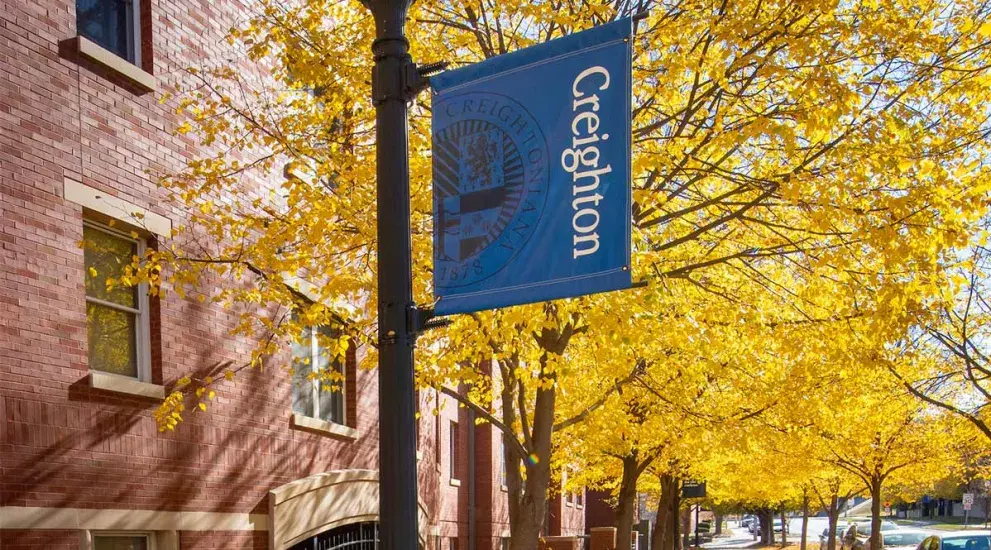 Creighton banner on lamp post