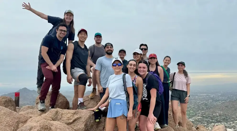 Students on outdoor adventure posing in group picture