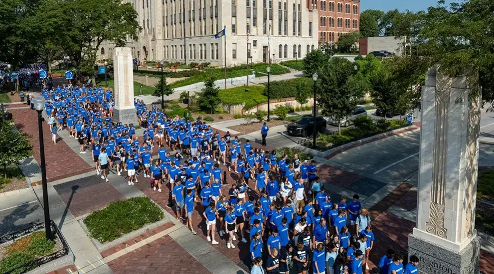 Birds Eye view of students in mass on campus mall.