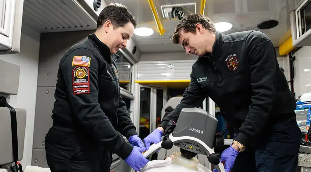 Two Paramedic students practicing through simulation.