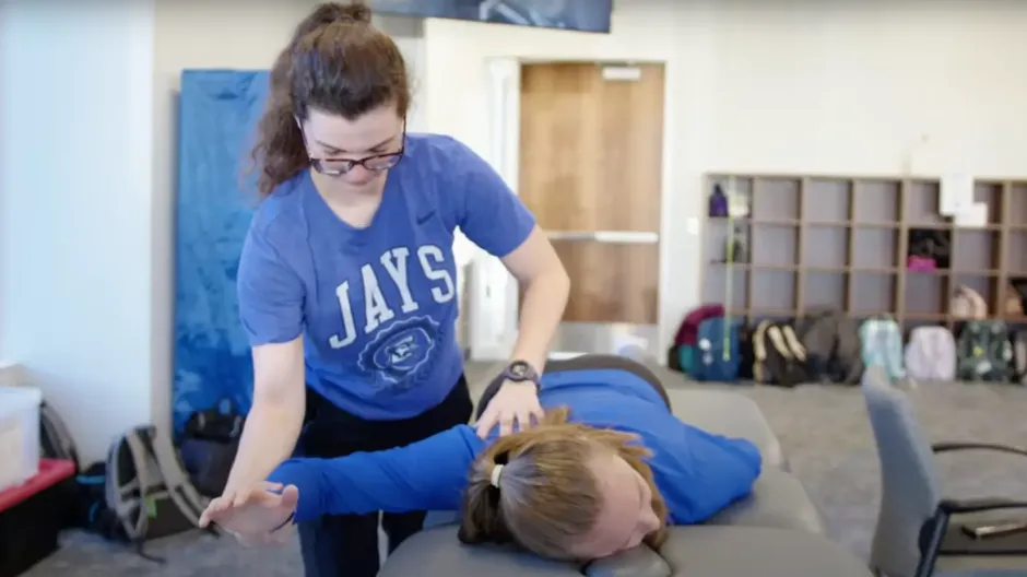 Therapist working on woman's shoulder